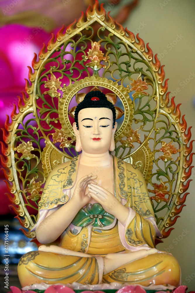 Fototapeta premium Huynh Dao buddhist pagoda. Buddha statue on altar. Chau Doc. Vietnam. 25.02.2017