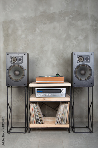 HiFi system with turntable, amplifier, headphones and lp vinyl records in a listening room
