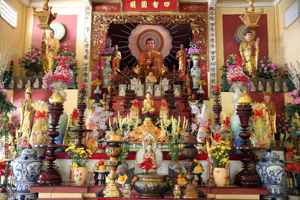 Buddhist temple. Main altar with Buddha statues.  Ho Chi Minh City.  Vietnam.  25.02.2017