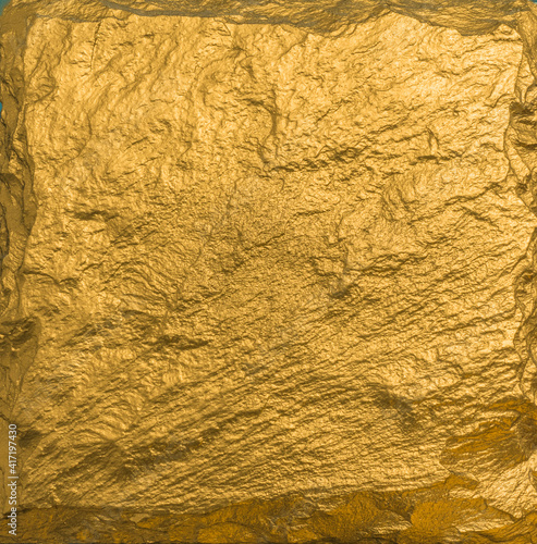 Gold texture. Rough structure mineral. Rock texture. Gold Ore. Gold rocks. Stone background.