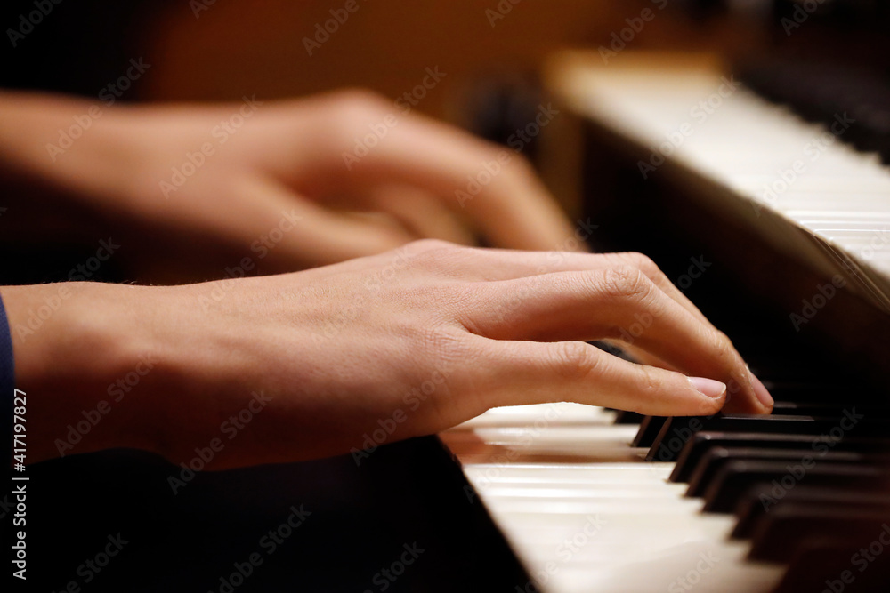 Obraz premium Sainte Clotilde Church. Organ player. Geneva. Switzerland. 24.12.2015