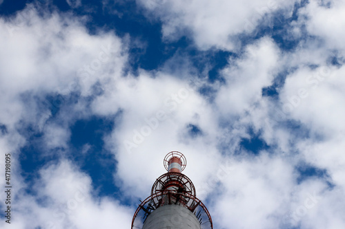 the top of the skyscraper and the cloudy sky