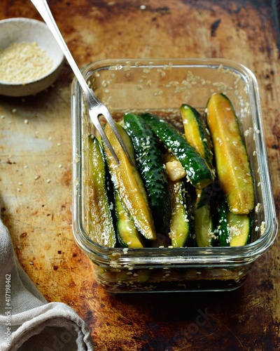 Рickled cucumbers in marinade of soy sauce, sesame, garlic