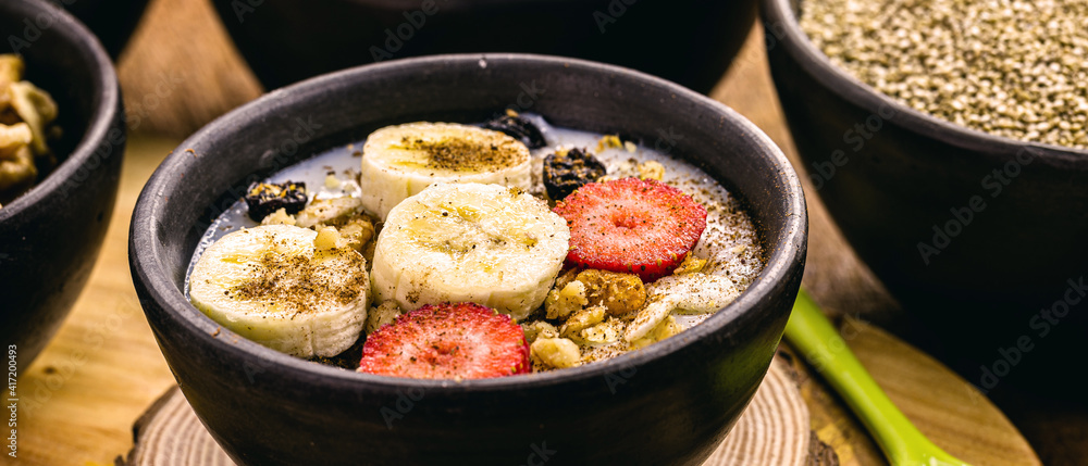 vegan quinoa porridge, Strawberry, bananas, ground nuts and sprinkled cinnamon. Lactose-free dessert without milk vegan quinoa porridge, Strawberry, bananas, ground nuts and sprinkled cinnamon. Lactose-free dessert without milk