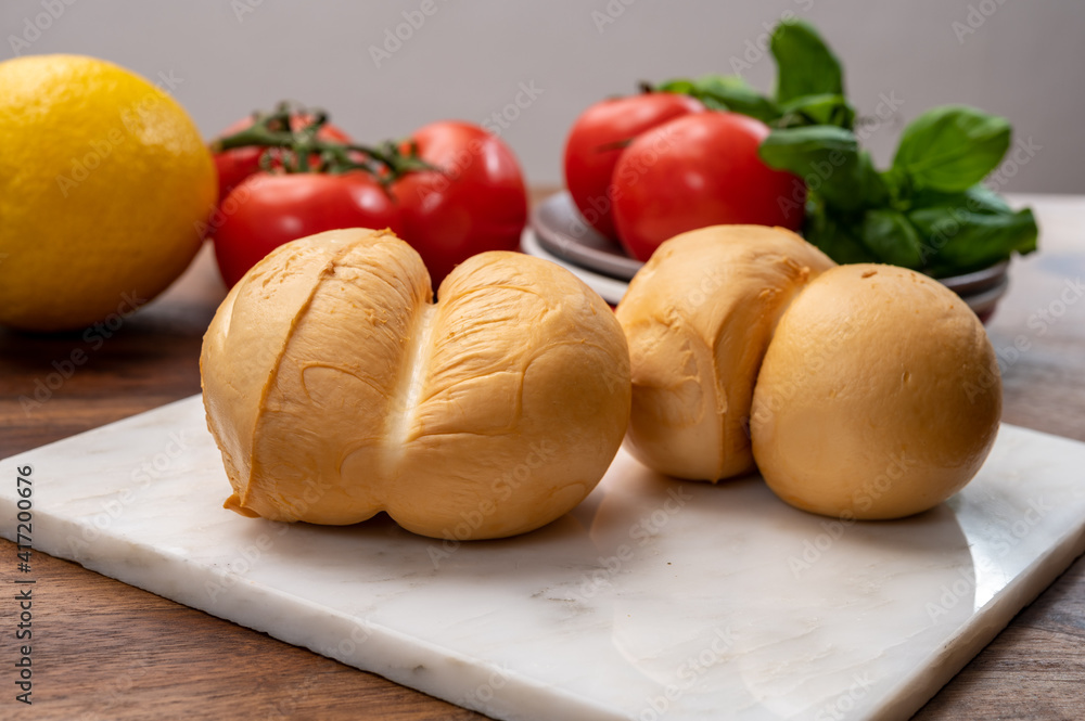 Cheese collection, Italian yellow smoked caciocavallo or scamorza cheese Cheese collection, Italian yellow smoked caciocavallo or scamorza cheese
