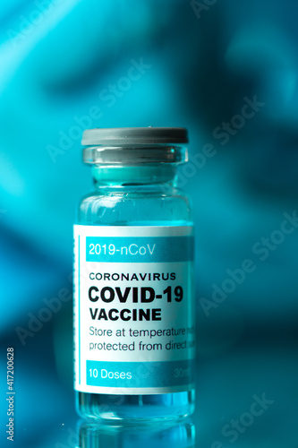 Medical concept ampoules or vials with Covid-19 vaccine on a laboratory bench