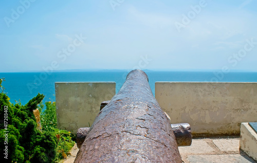 The old rusty cannon of War Memorial, Bonifacio, Corsica, France photo