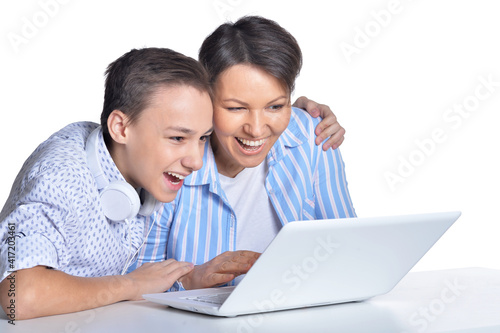 Happy mother and son using laptop