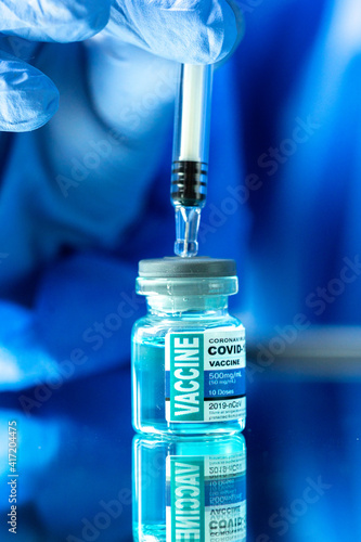 Medical concept ampoules or vials with Covid-19 vaccine on a laboratory bench.