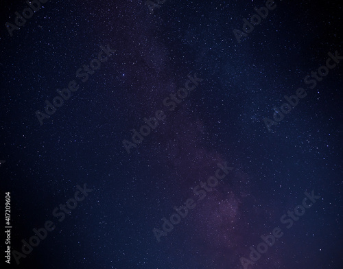 Multicolored stars in the night sky. The Milky Way.
