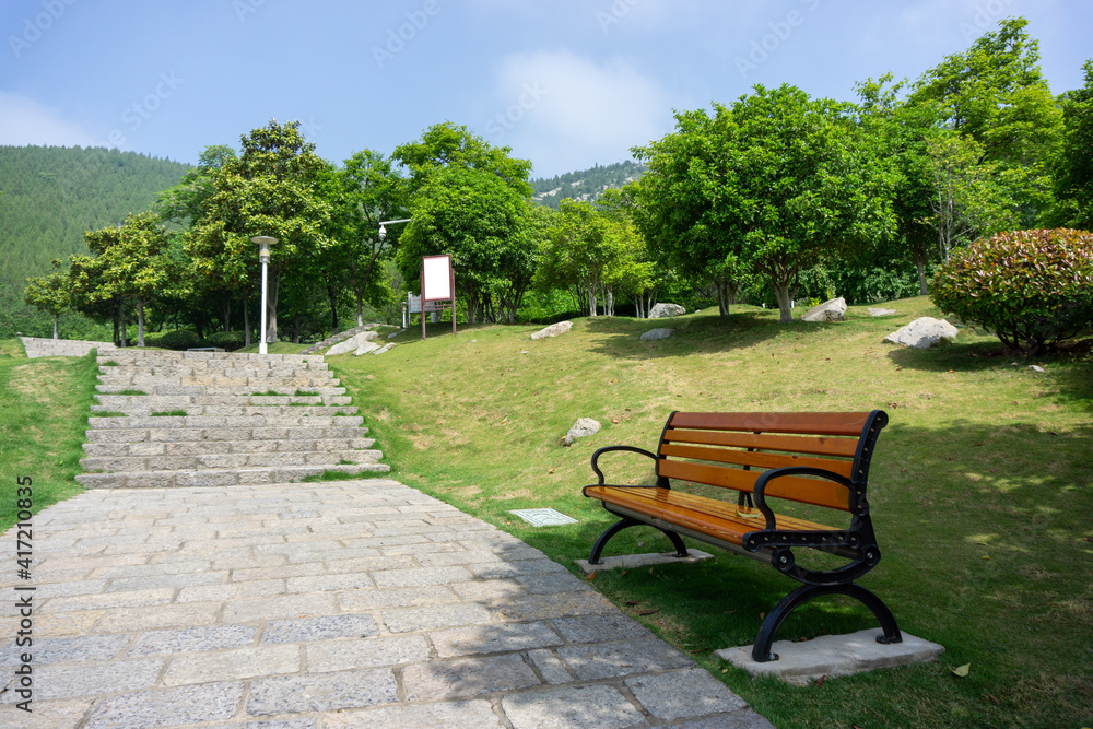 The city park morning, path, woods and long seats, quiet and peaceful scenery. The city park morning, path, woods and long seats, quiet and peaceful scenery.
