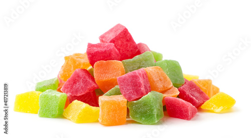 Heap of candied fruit pieces on a white background. Isolated