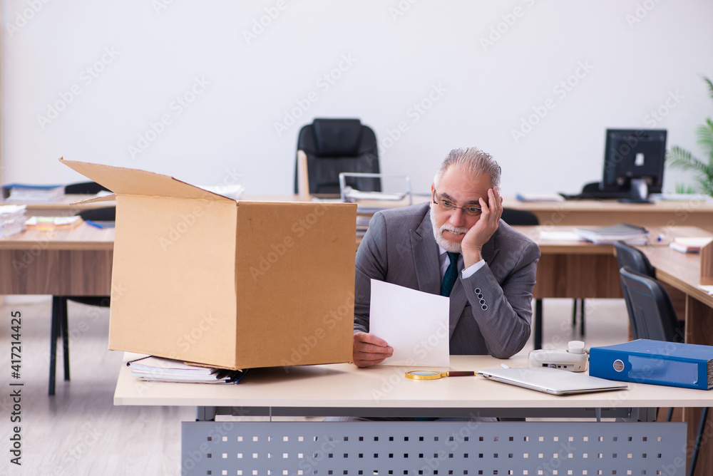 Old male employee being fired from his work Old male employee being fired from his work