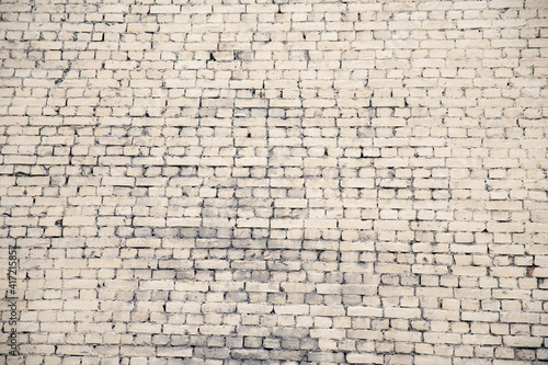 The brick wall of a building in the town, ivory