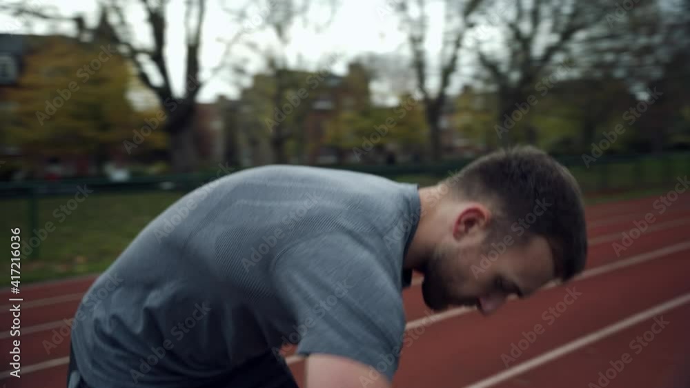 Caucasian male athlete packing up carrying backpack Caucasian male athlete packing up carrying backpack