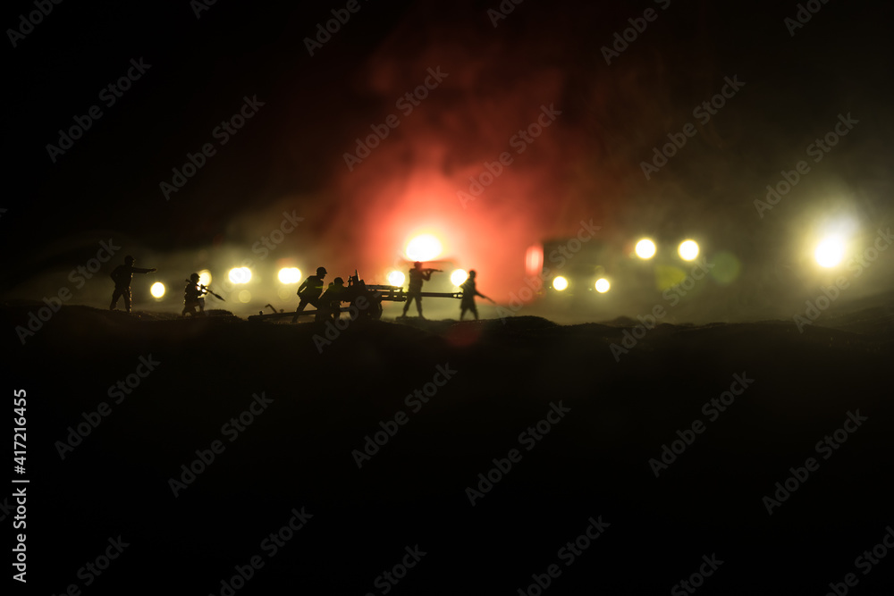 War Concept. Military silhouettes fighting scene on war fog sky background. Attack scene. Armored vehicles and infantry.