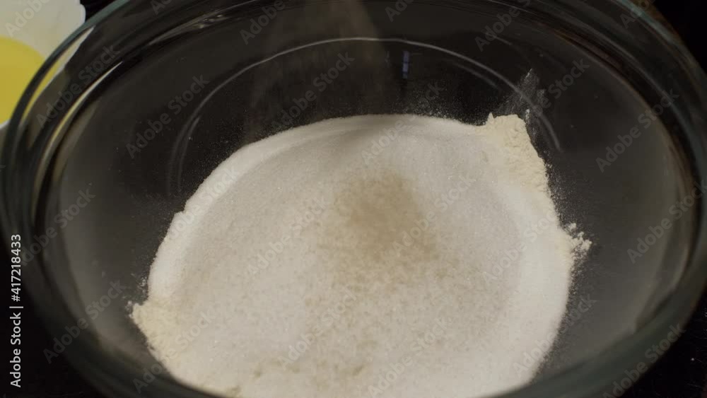 Yeast Being Added On Top Of Flour In Mixing Bowl. Locked Off Yeast Being Added On Top Of Flour In Mixing Bowl. Locked Off
