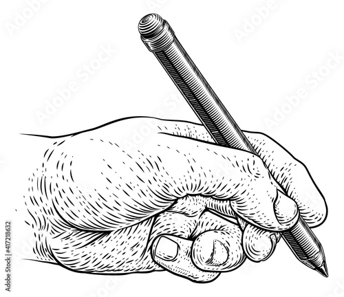 A hand holding a pencil in ...