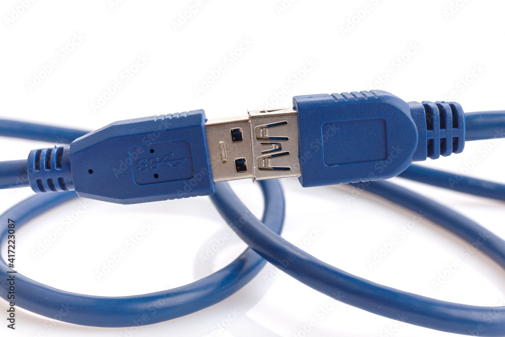 Blue USB 3.0 of power and data extension cable isolated on white background. Closeup Blue USB 3.0 of power and data extension cable isolated on white background. Closeup