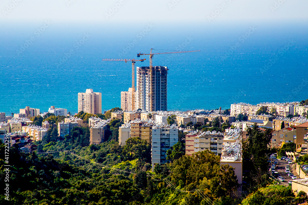 Construction of a high-rise building using monolithic frame construction technology against the background of the sea