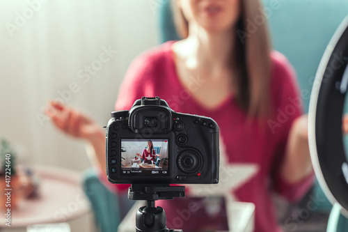 Close-up camera screen, woman blogger makes video of unpacking gadgets