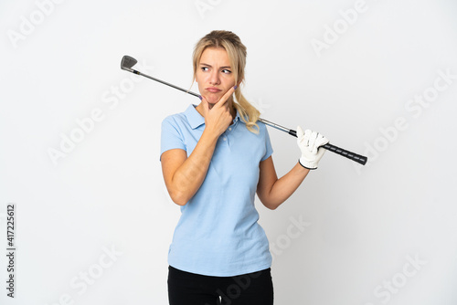 Young Russian golfer woman isolated on white background having doubts
