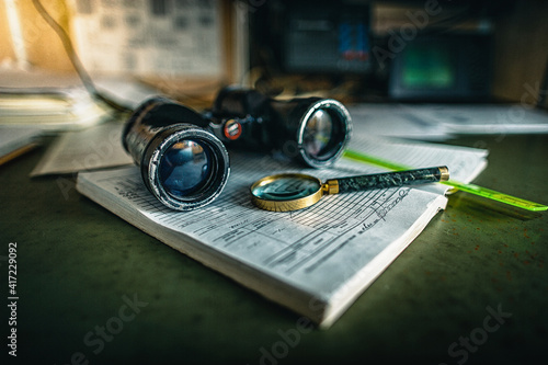 old binoculars and magnifying glass