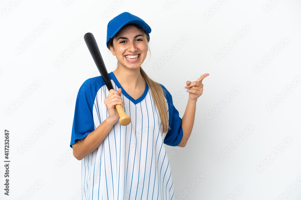 Young caucasian woman playing baseball isolated on white background pointing finger to the side Young caucasian woman playing baseball isolated on white background pointing finger to the side