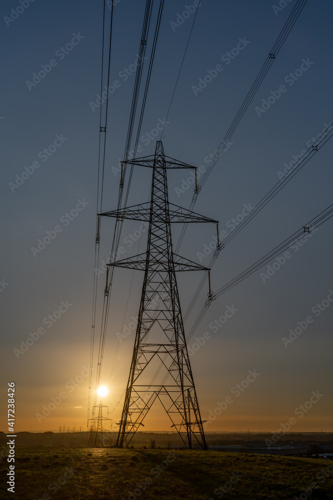 Electricity Pylon carrying electric power across the united kingdom. Large steel tower high above the landscape. 