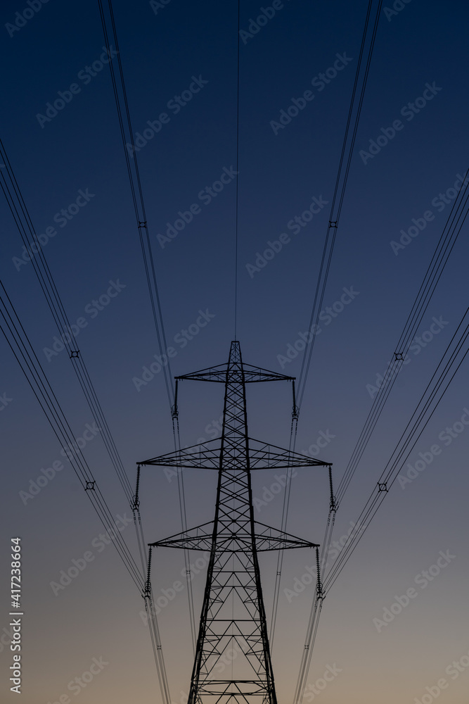 Electricity Pylon carrying electric power across the united kingdom. Large steel tower high above the landscape. 