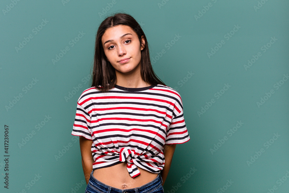 Young Indian woman isolated on blue background sad, serious face, feeling miserable and displeased. Young Indian woman isolated on blue background sad, serious face, feeling miserable and displeased.