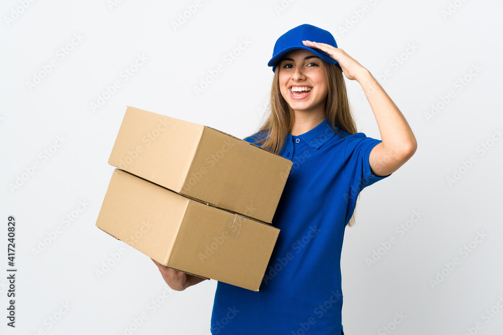 Young delivery woman over isolated white background saluting with hand with happy expression Young delivery woman over isolated white background saluting with hand with happy expression