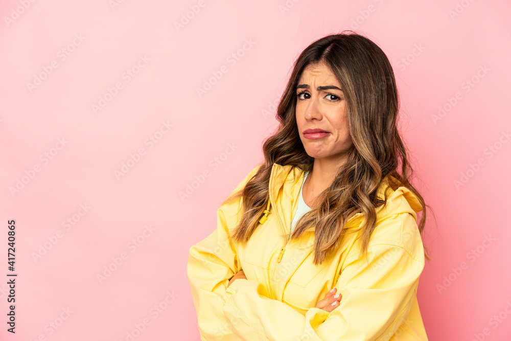Young caucasian woman isolated suspicious, uncertain, examining you. Young caucasian woman isolated suspicious, uncertain, examining you.