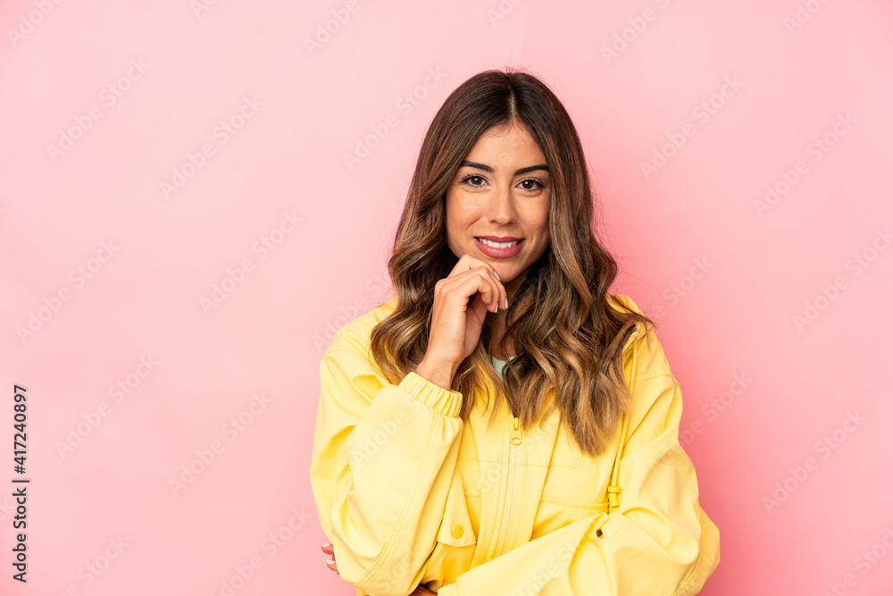 Young caucasian woman isolated smiling happy and confident, touching chin with hand. Young caucasian woman isolated smiling happy and confident, touching chin with hand.