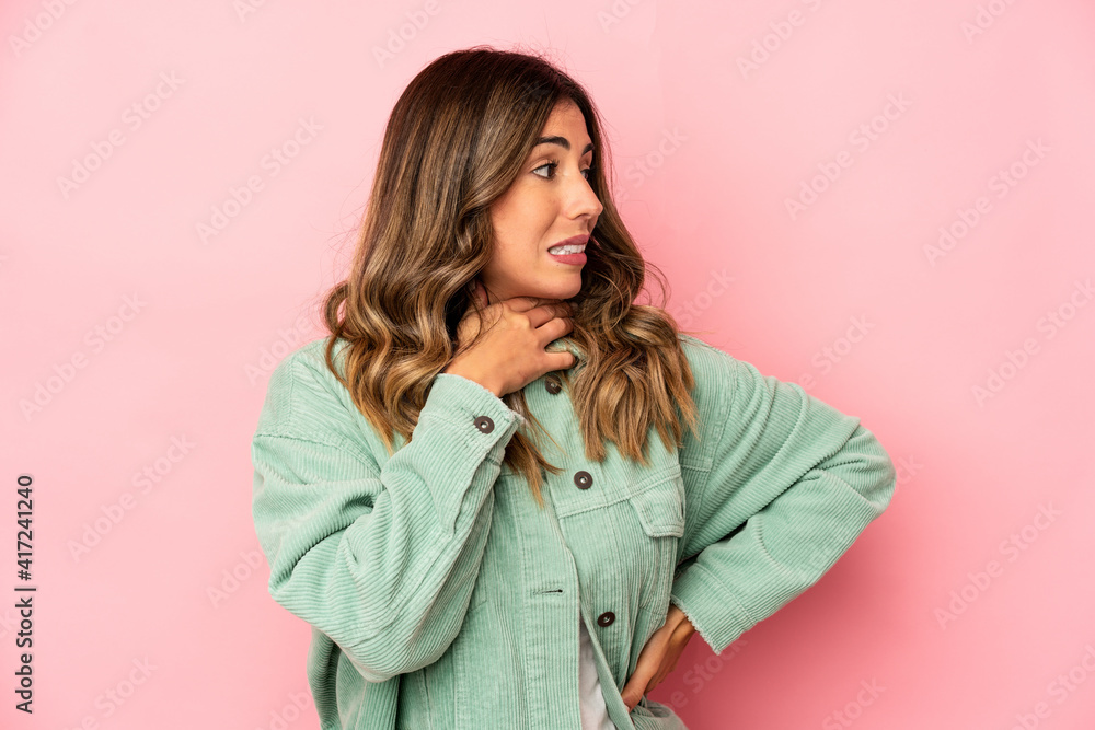 Young caucasian woman isolated touching back of head, thinking and making a choice. Young caucasian woman isolated touching back of head, thinking and making a choice.