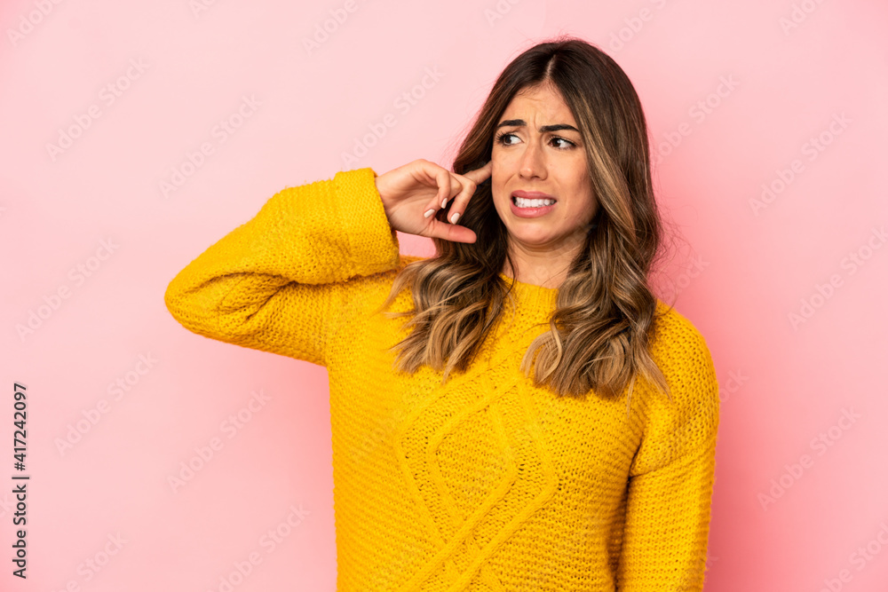 Young caucasian woman isolated covering ears with hands. Young caucasian woman isolated covering ears with hands.