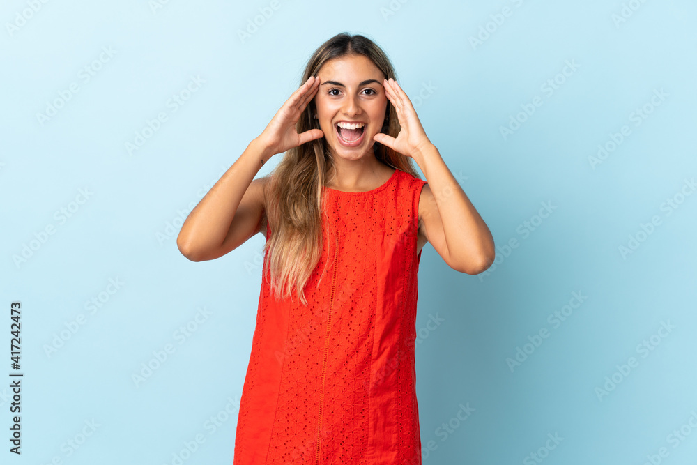 Young hispanic woman over isolated blue background with surprise expression Young hispanic woman over isolated blue background with surprise expression