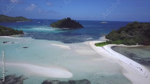 blue ocean and sandbars and islands of Saint-Anne Marine National Park drone flight