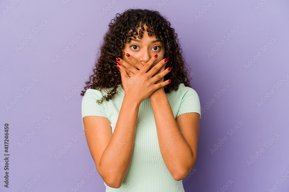 Young african american afro woman isolated shocked covering mouth with hands. Young african american afro woman isolated shocked covering mouth with hands.