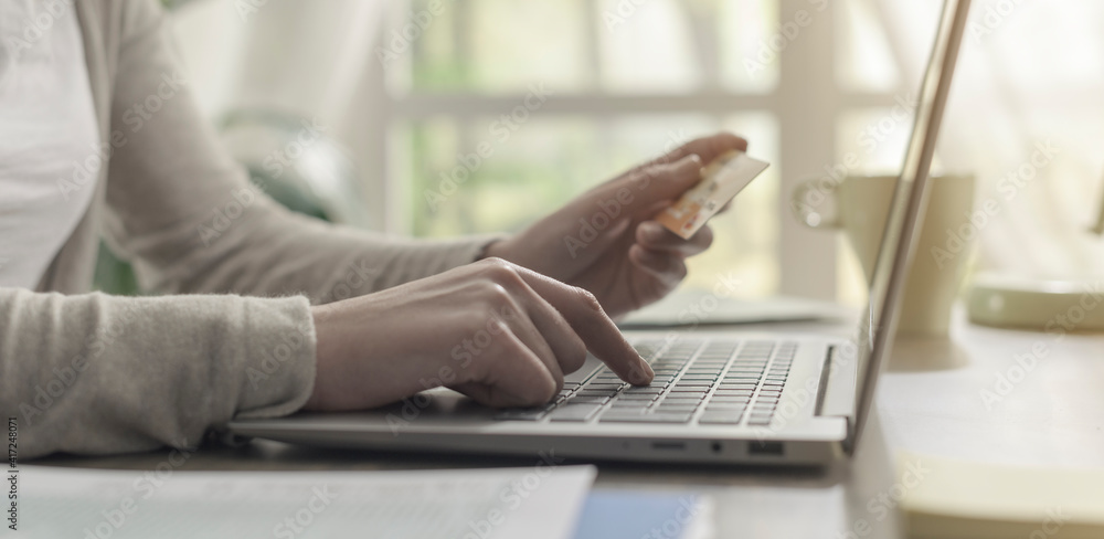 Woman doing online shopping at home Woman doing online shopping at home