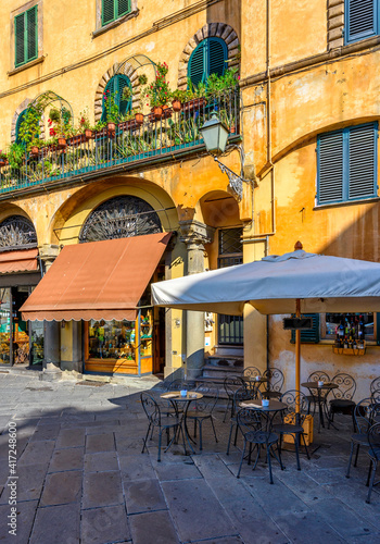 Old cozy street in Lucca, Italy. Lucca is a city and comune in Tuscany. It is the capital of the Province of Lucca photo