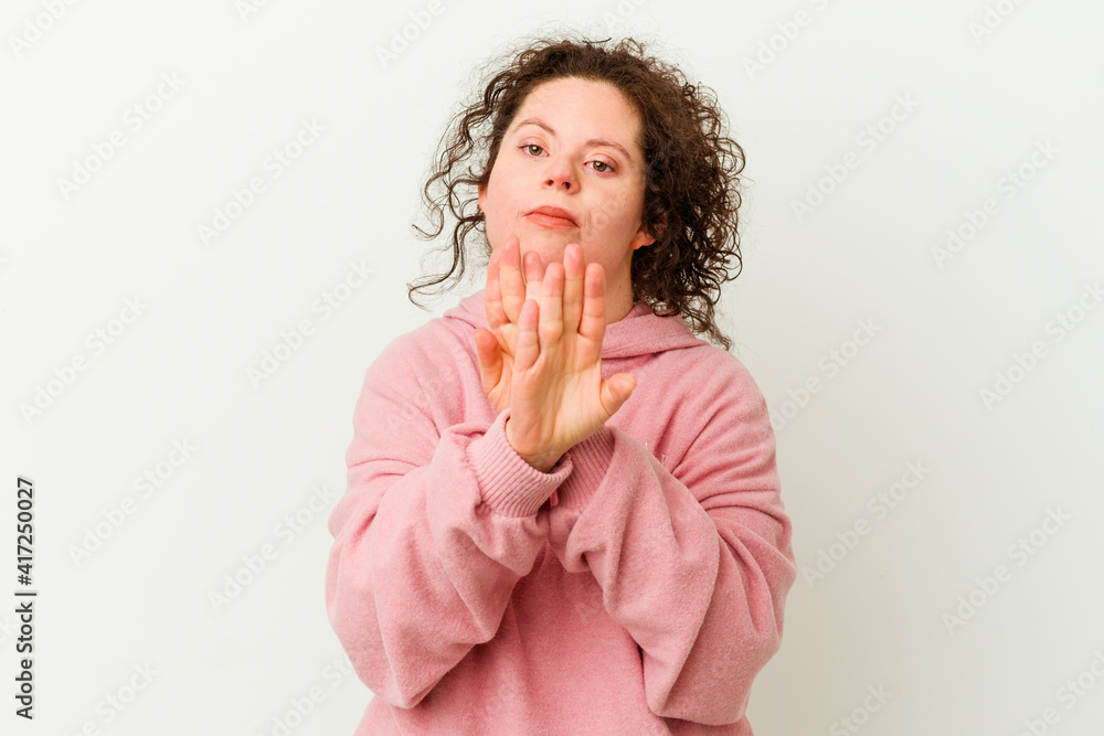 Woman with Down syndrome isolated doing a denial gesture