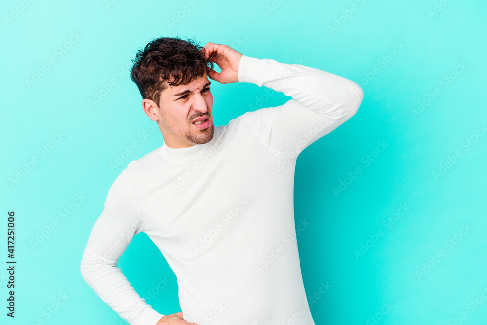 Young caucasian man isolated on blue background celebrating a victory, passion and enthusiasm, happy expression. Young caucasian man isolated on blue background celebrating a victory, passion and enthusiasm, happy expression.