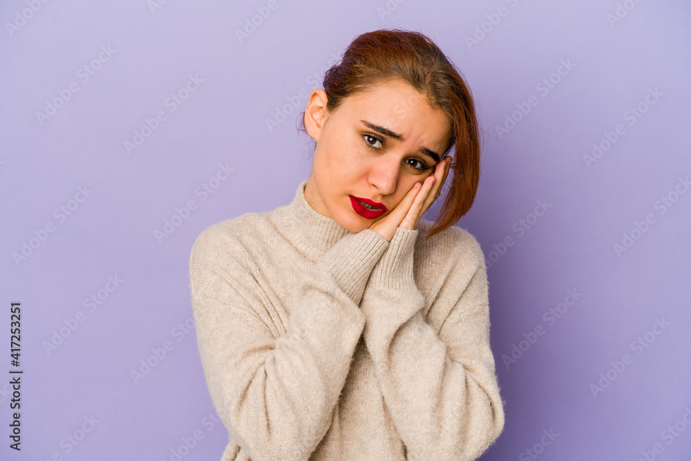 Young arab mixed race woman yawning showing a tired gesture covering mouth with hand. Young arab mixed race woman yawning showing a tired gesture covering mouth with hand.