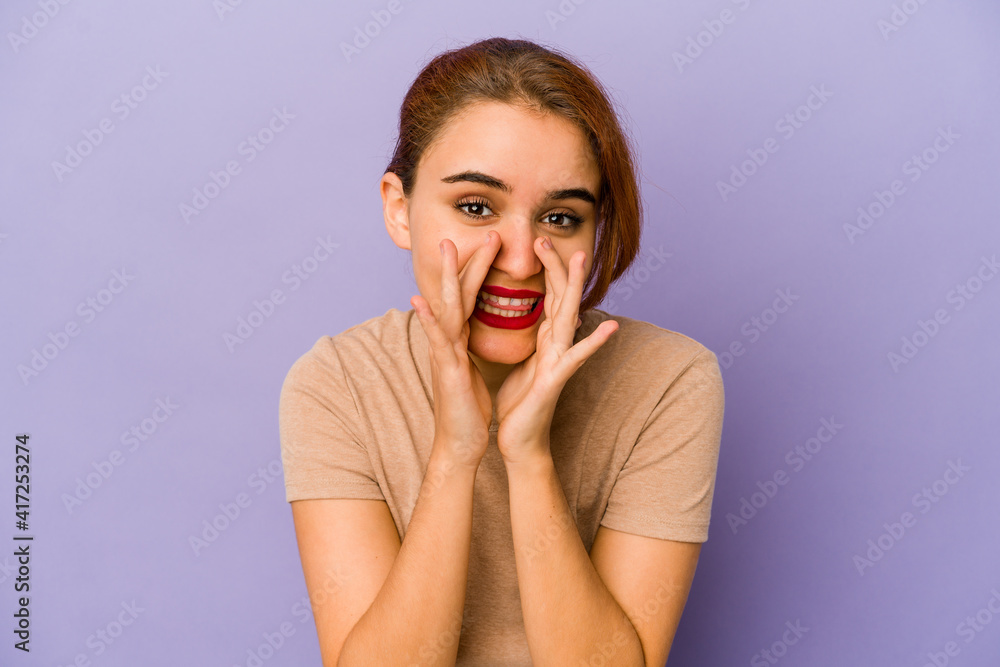 Young arab mixed race woman saying a gossip, pointing to side reporting something. Young arab mixed race woman saying a gossip, pointing to side reporting something.