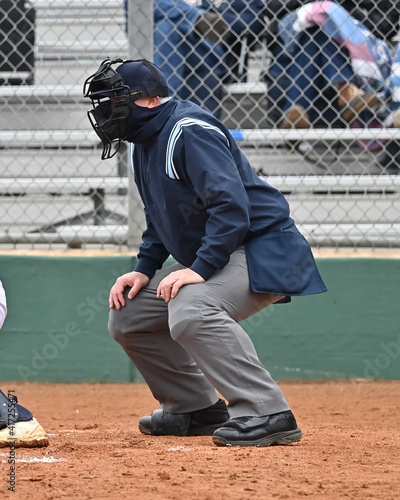 Baseball or Softball umpire calling balls and strikes during a game