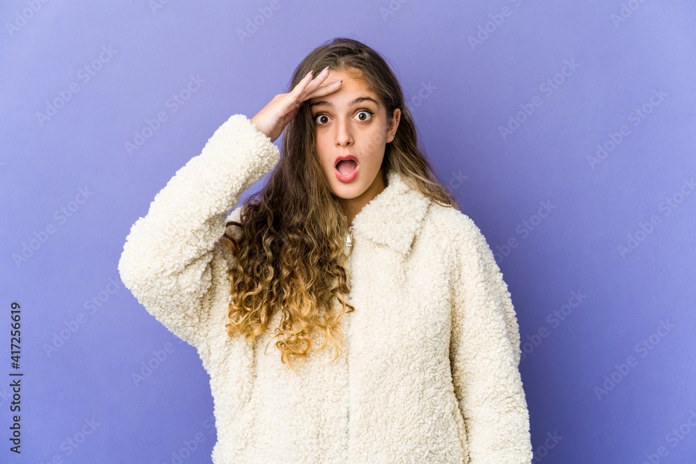 Young caucasian cute woman shouts loud, keeps eyes opened and hands tense. Young caucasian cute woman shouts loud, keeps eyes opened and hands tense.