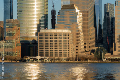 New York, NY - USA - Feb. 27, 2021: Landscape view of Manhattan's Brookfield Place Ferry Terminal and the Battery Park City neighborhood of Manhattan at sunset.