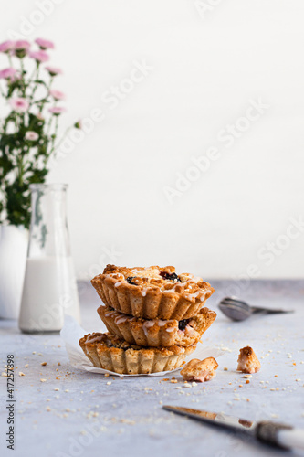 Mini tarts with plum and streusel. photo