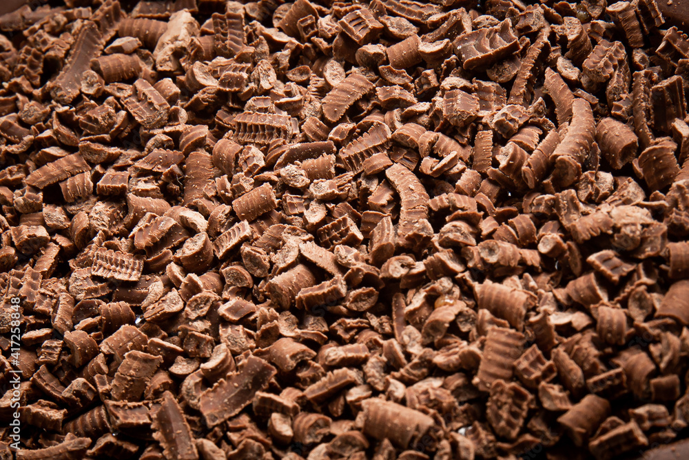 Close up of a grated chocolate. Top view. Close up of a grated chocolate. Top view.